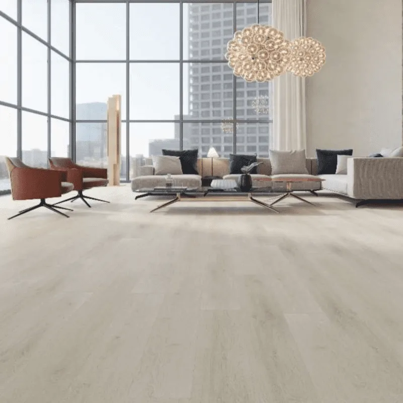 AlUmaima Interiors light oak parquet flooring in a sunlit luxury Dubai living space with floor-to-ceiling windows.