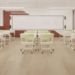 AlUmaima Interiors modern classroom with pistachio chairs and light wood parquet in a luxury Dubai school fit-out.