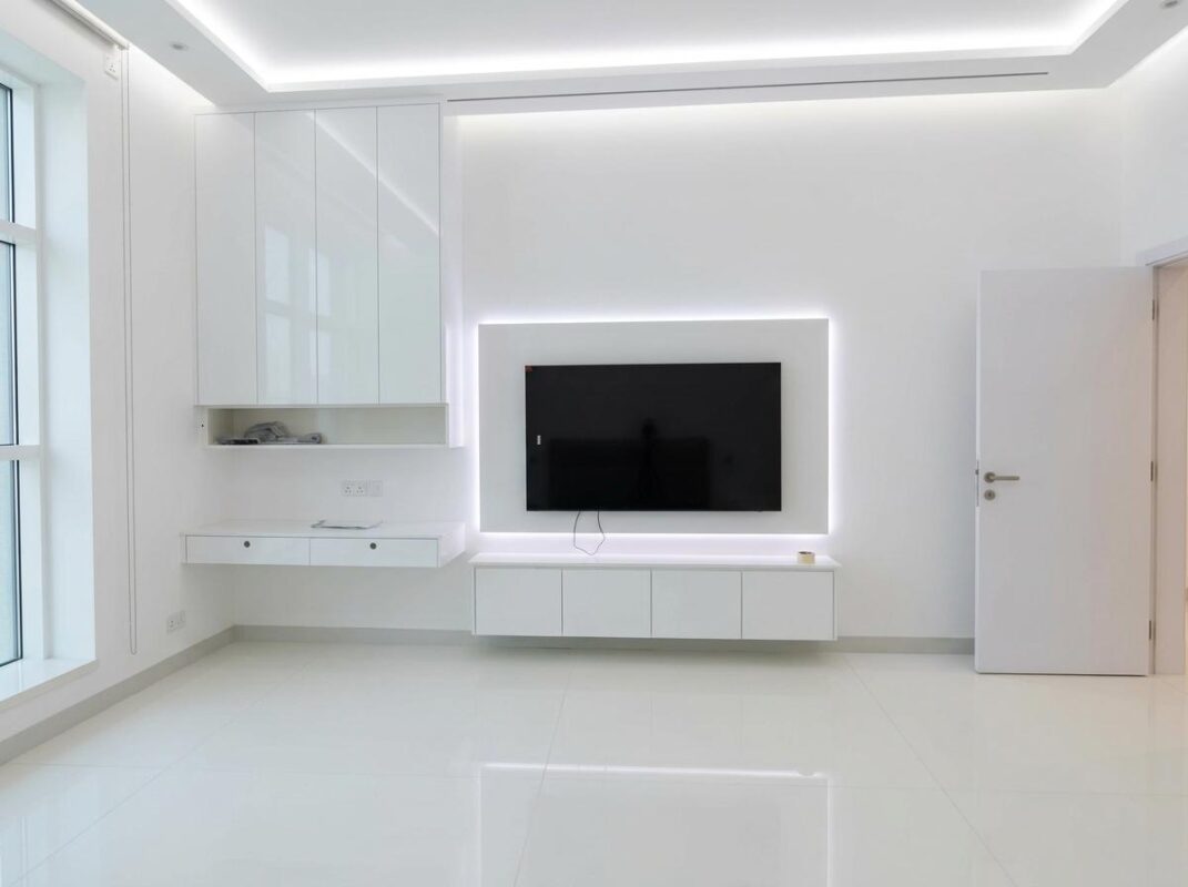 clean white media wall with cabinets dubai and abu dhabi